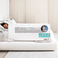 Load image into Gallery viewer, Metal bed safety barrier with white cloth cover for sleeping children.  A sleeping child shows the bed rail in use.
